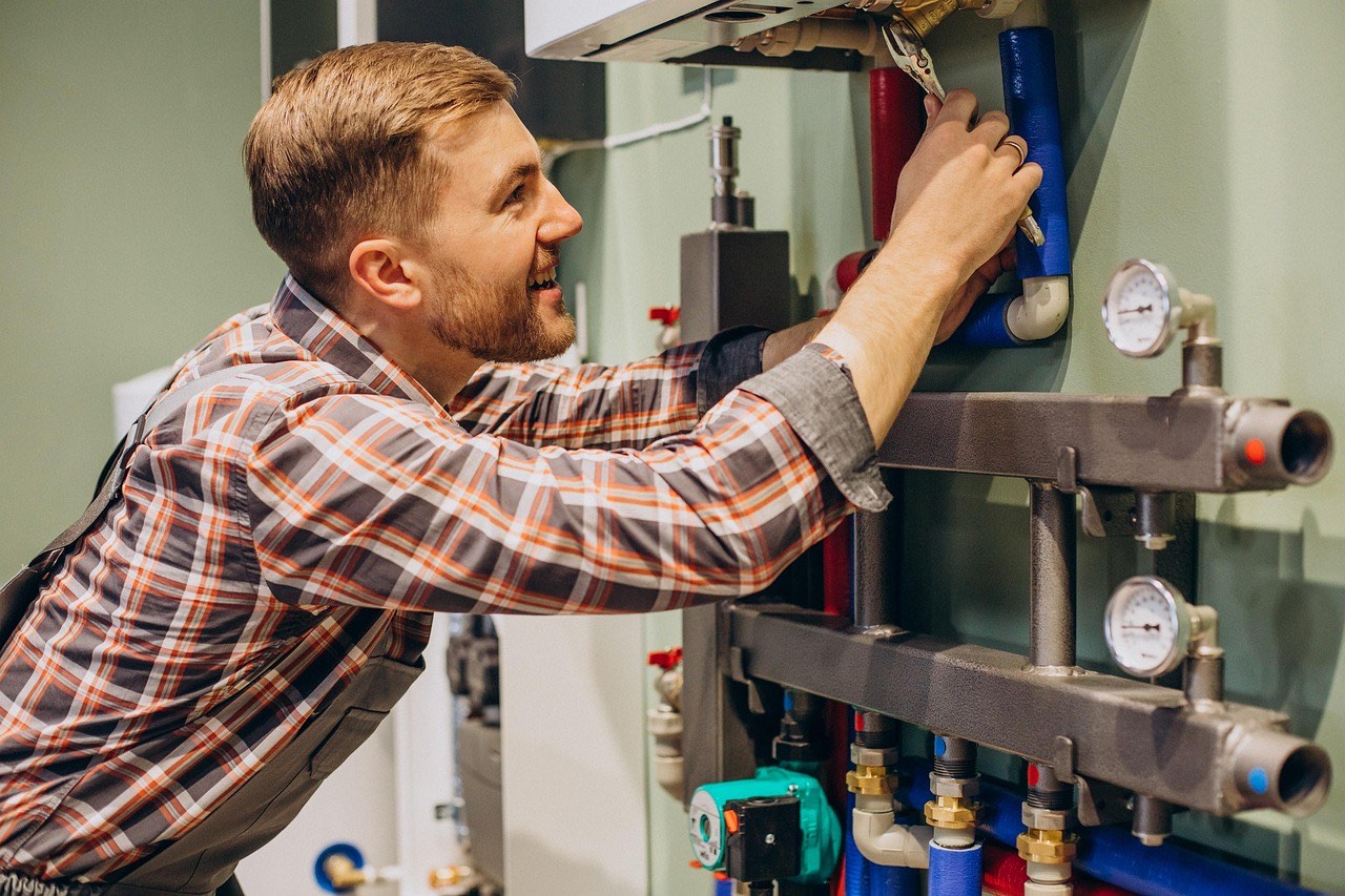 Boiler Repairs plumber carrying out boiler repair in London