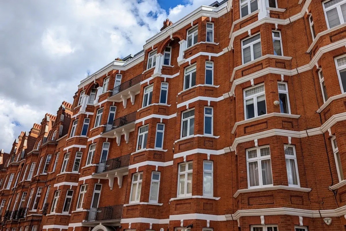 a red-brick London mansion block of flats near Ealing, London